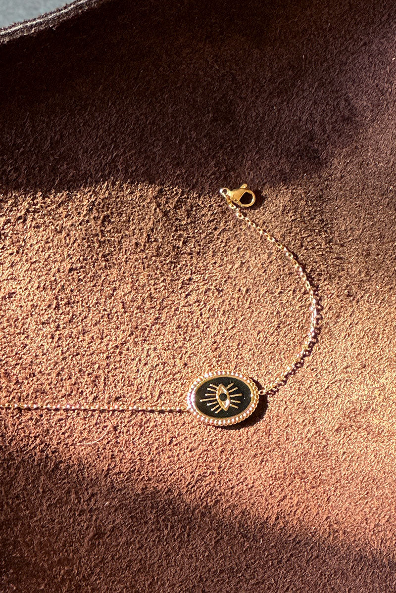 CORALIE | Pulsera de eslabones finos dorados con ojo negro