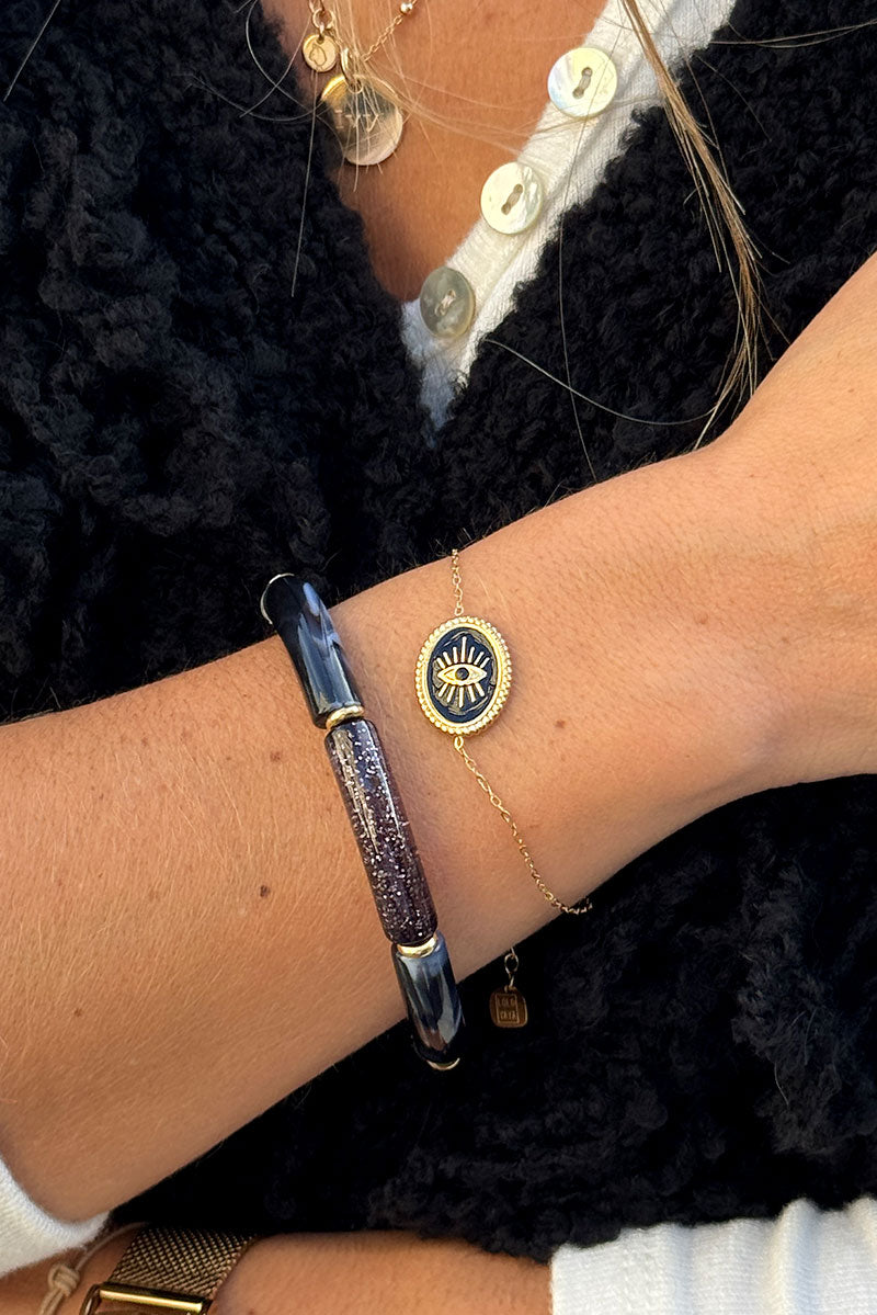 CORALIE | Pulsera de eslabones finos dorados con ojo negro