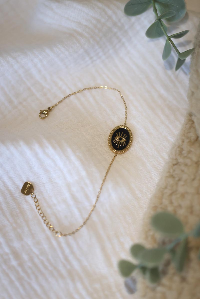 CORALIE | Pulsera de eslabones finos dorados con ojo negro