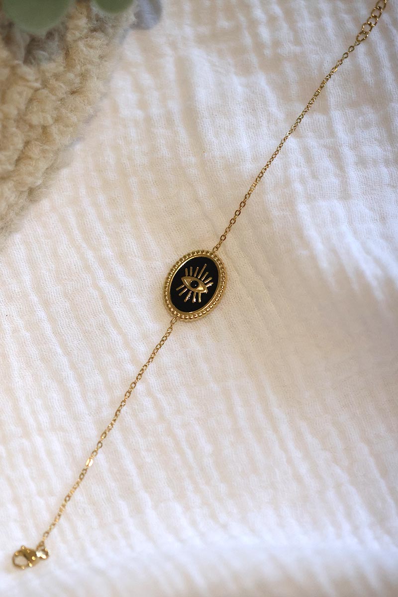 CORALIE | Pulsera de eslabones finos dorados con ojo negro